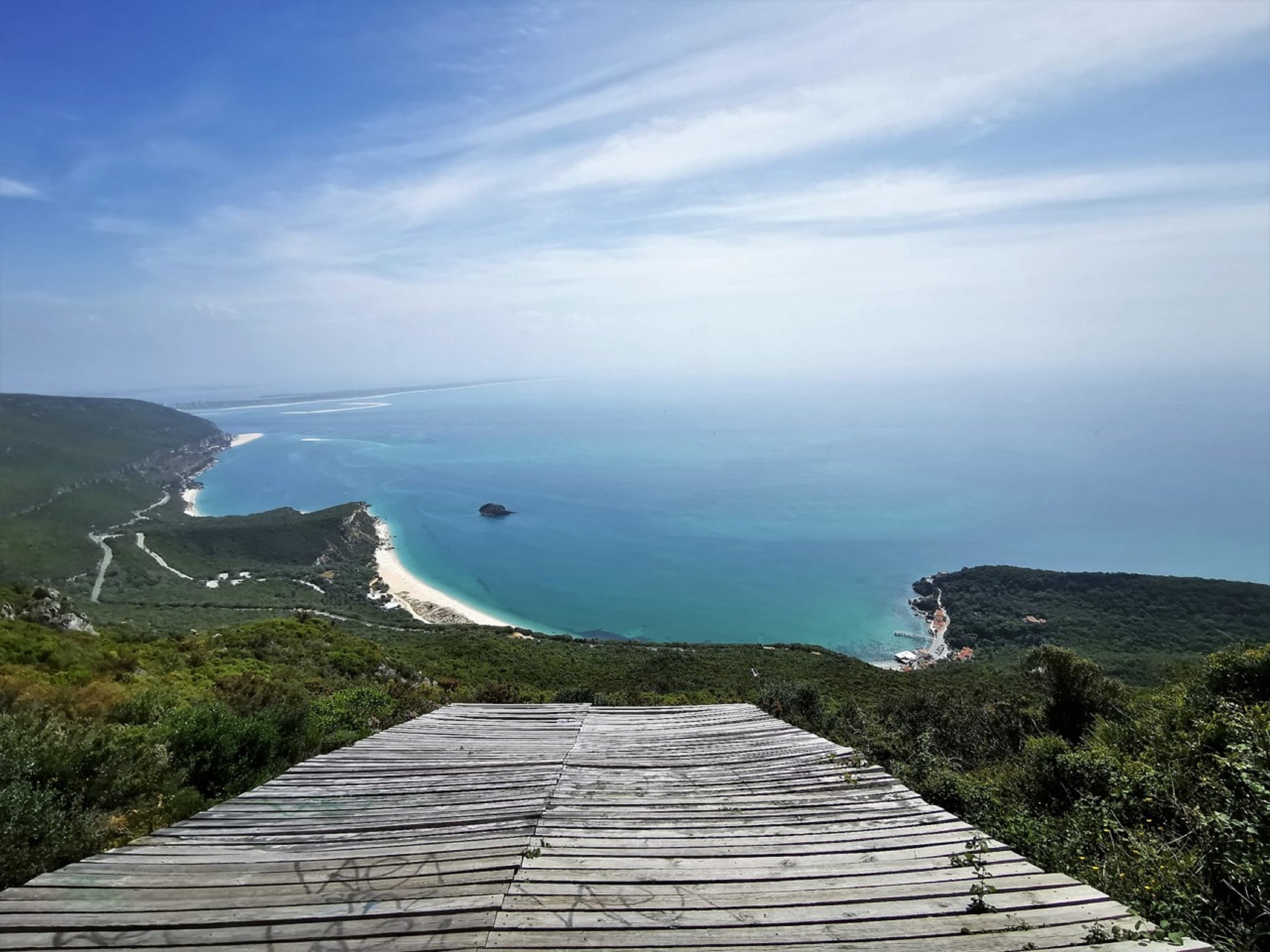 Wooden viewpoint platform overlooking Arrábida coastline and turquoise Atlantic, Serra da Arrábida Natural Park