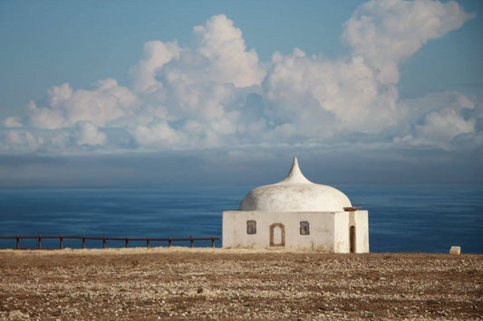 Ermida de Nossa Senhora do Cabo Espichel white domed chapel on coastal plateau overlooking Atlantic ocean, Setúbal Peninsula, The Untold Weekend